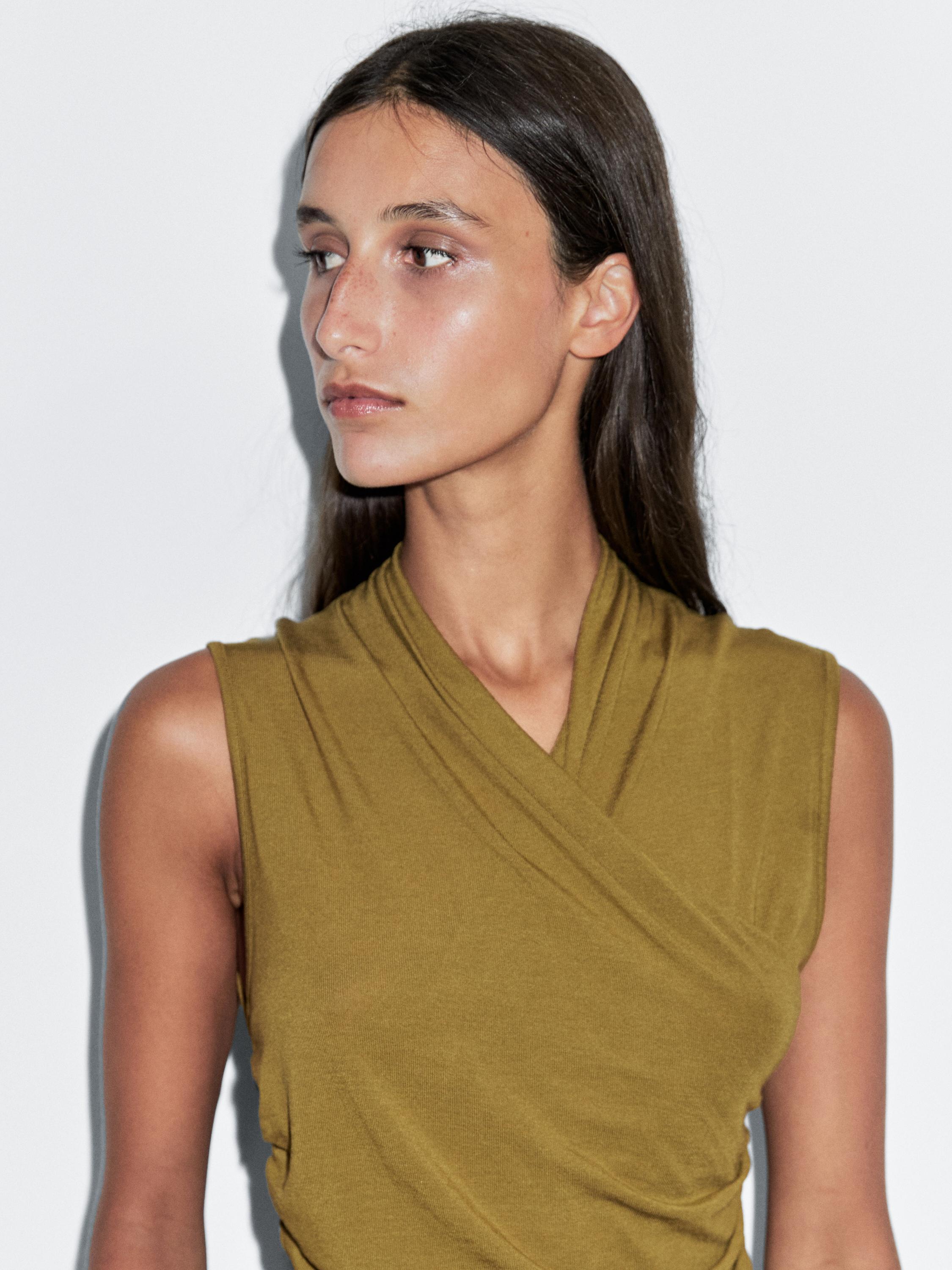Draped top with surplice neckline